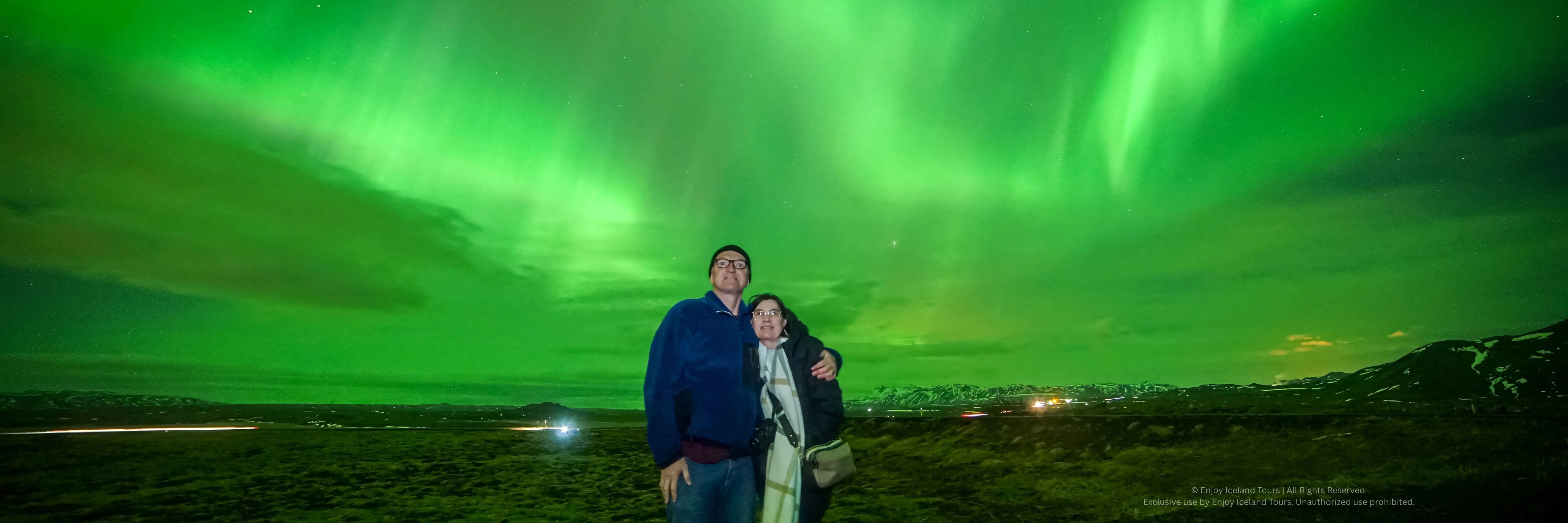 Couple enjoying a private Northern Lights tour in Iceland
